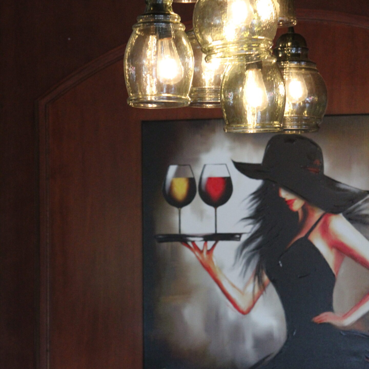A stylish painting of a woman holding two glasses of wine under hanging lights.